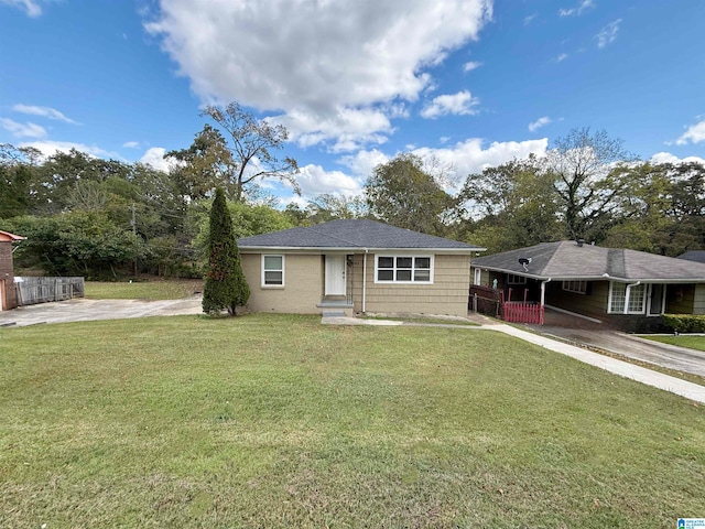 ranch-style home with a front yard