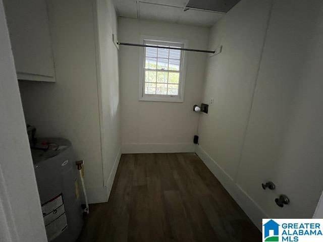 laundry room featuring dark wood-type flooring