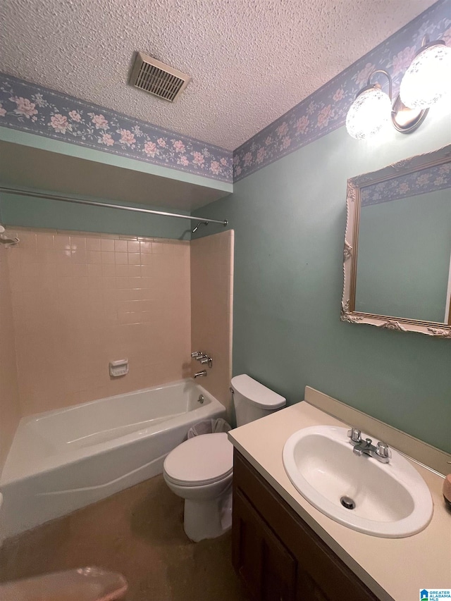 full bathroom featuring  shower combination, vanity, a textured ceiling, and toilet