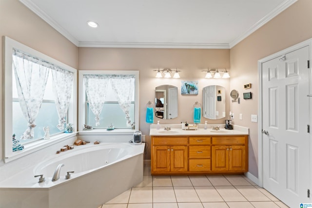 bathroom featuring a bathtub, vanity, tile patterned floors, and crown molding