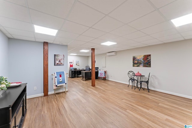 rec room featuring a paneled ceiling and wood-type flooring