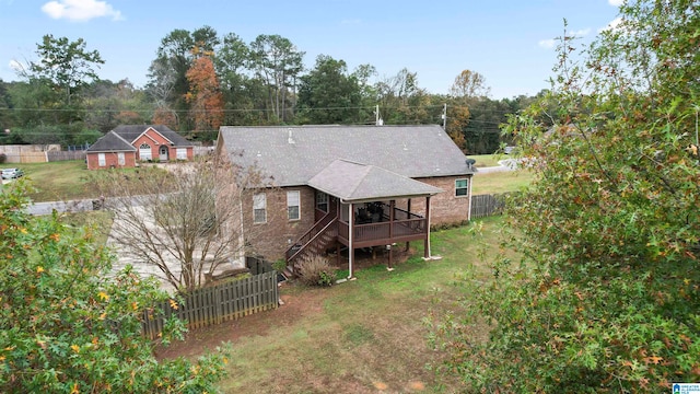 rear view of property with a wooden deck