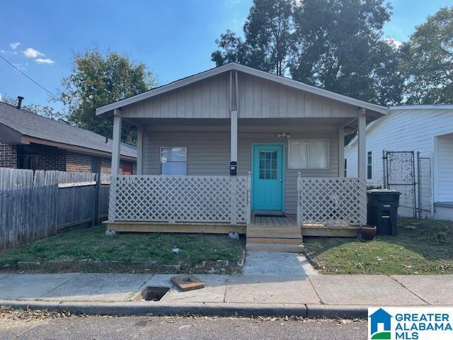 109 2nd Ave SW, Birmingham, AL 35211 - bungalow-style home featuring fence and covered porch