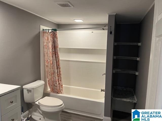 full bathroom featuring vanity, toilet, shower / tub combo, and hardwood / wood-style floors