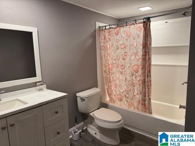 109 2nd Ave SW, Birmingham, AL 35211 - full bathroom with shower / bath combination with curtain, crown molding, wood finished floors, vanity, and toilet