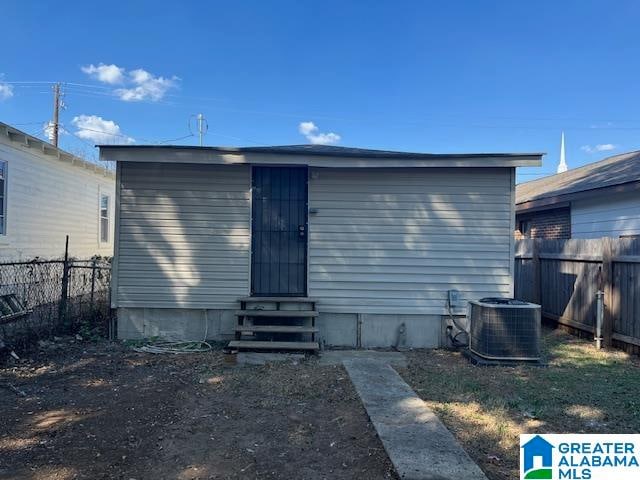 rear view of property featuring central air condition unit