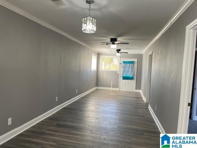 109 2nd Ave SW, Birmingham, AL 35211 - unfurnished room featuring ceiling fan, ornamental molding, dark wood finished floors, and visible vents