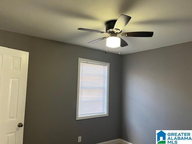 109 2nd Ave SW, Birmingham, AL 35211 - spare room with baseboards and a ceiling fan
