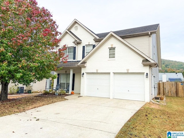 view of front of home with central AC and a garage