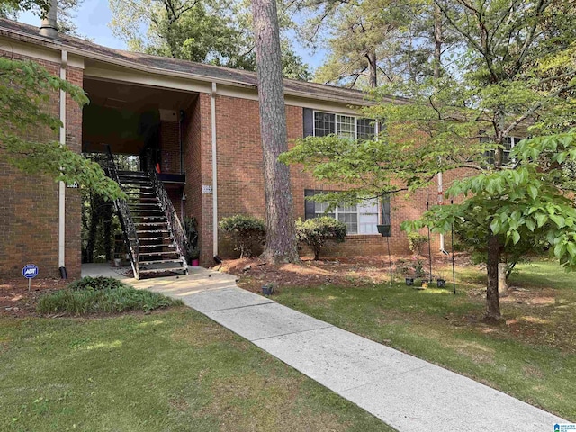 2082 Montreat Cir Unit 2082, Vestavia Hills, AL 35216 - view of front of property featuring brick siding, a front lawn, and stairs