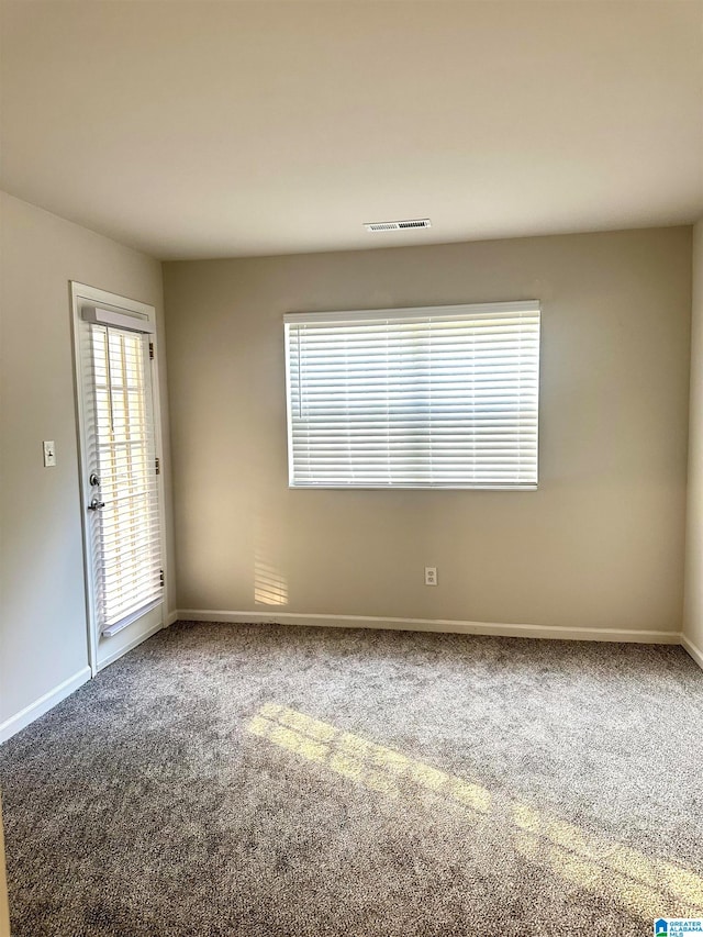 view of carpeted spare room