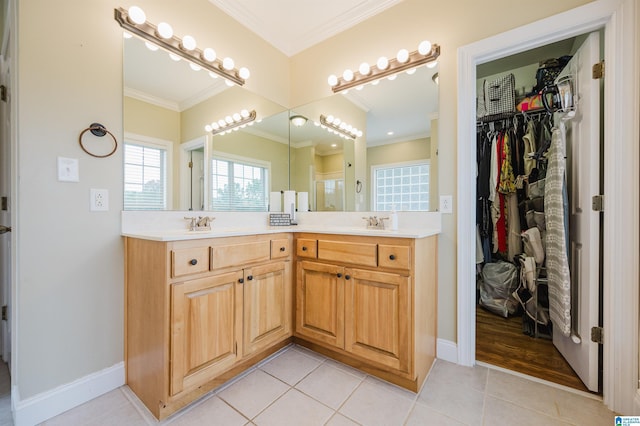 bathroom featuring vanity, tile patterned floors, and crown molding