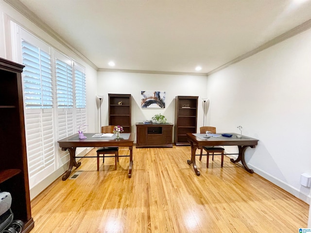 office area featuring light hardwood / wood-style floors and ornamental molding