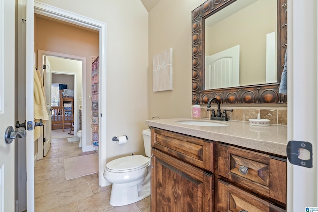 bathroom with vanity and toilet