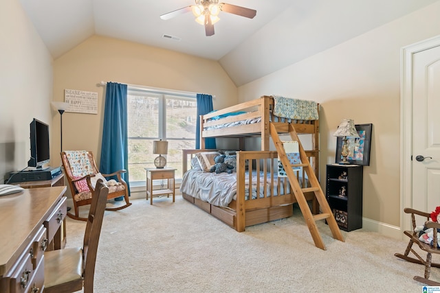 bedroom featuring lofted ceiling, light colored carpet, and ceiling fan