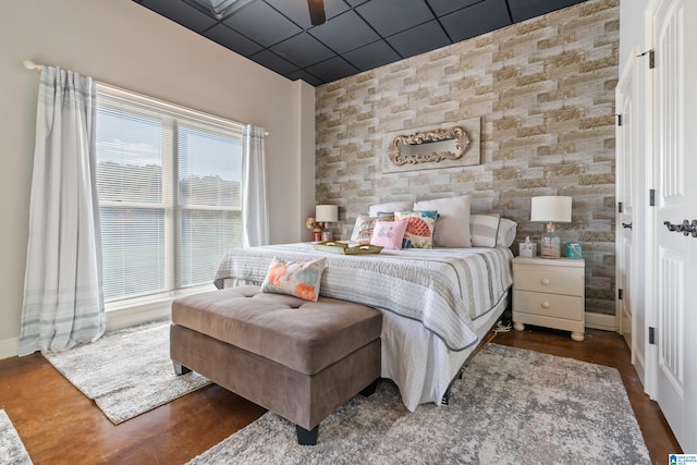 bedroom with dark hardwood / wood-style floors