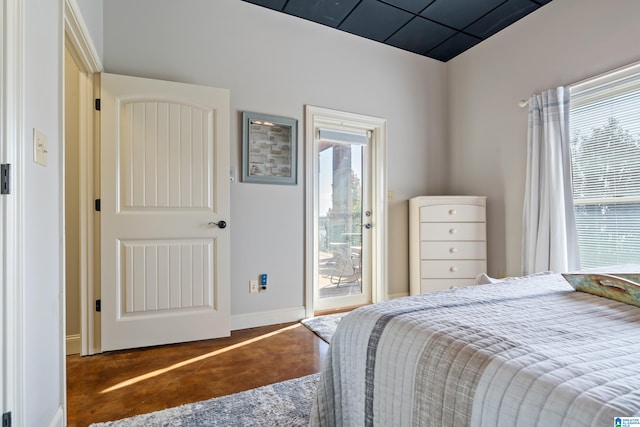 tiled bedroom with multiple windows