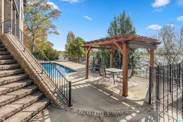 view of swimming pool featuring a patio area and a pergola