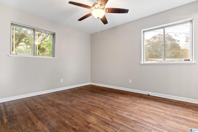 empty room featuring hardwood / wood-style floors and ceiling fan