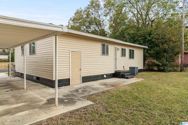 exterior space featuring a yard, a patio, and central AC unit