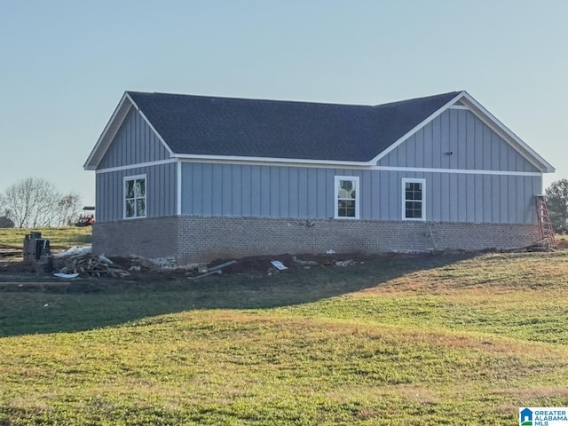 view of home's exterior with a yard