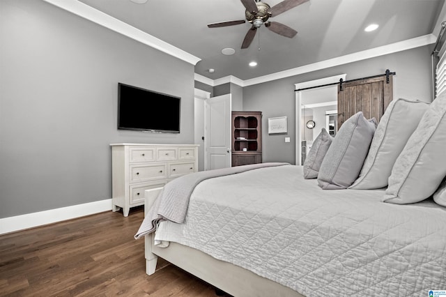 bedroom featuring dark hardwood / wood-style flooring, crown molding, a barn door, and ceiling fan