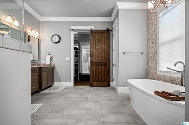 bathroom featuring a wealth of natural light, vanity, hardwood / wood-style floors, and a bathing tub