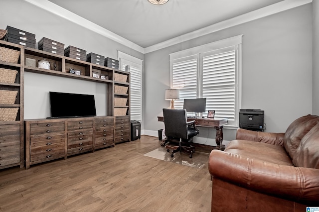 home office with crown molding and hardwood / wood-style floors