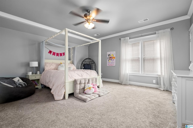 carpeted bedroom featuring ceiling fan and ornamental molding