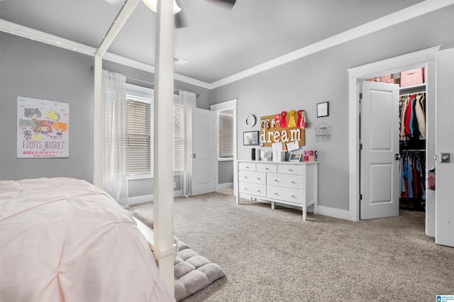 carpeted bedroom with ceiling fan and crown molding