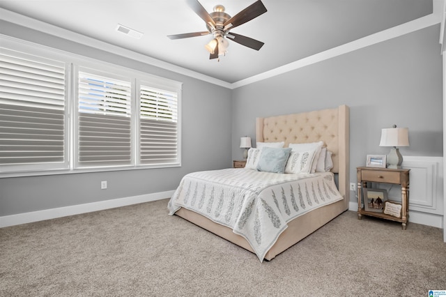 bedroom with crown molding, carpet, and ceiling fan