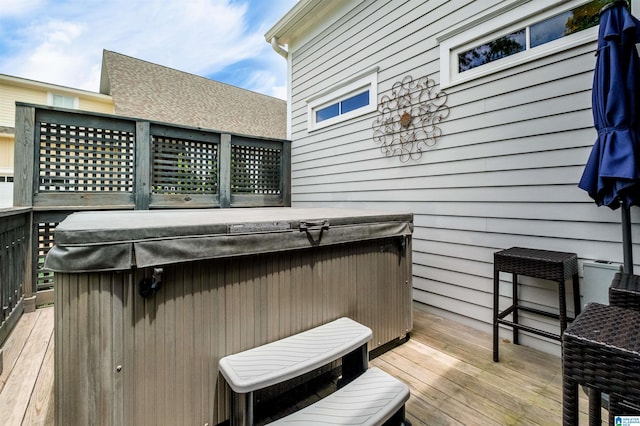 deck featuring a hot tub