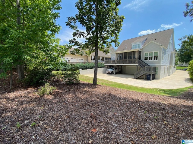 back of property featuring a sunroom