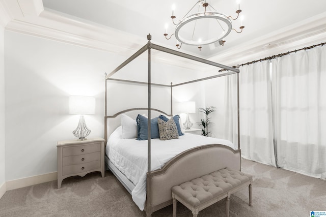 bedroom with crown molding, carpet flooring, and a tray ceiling