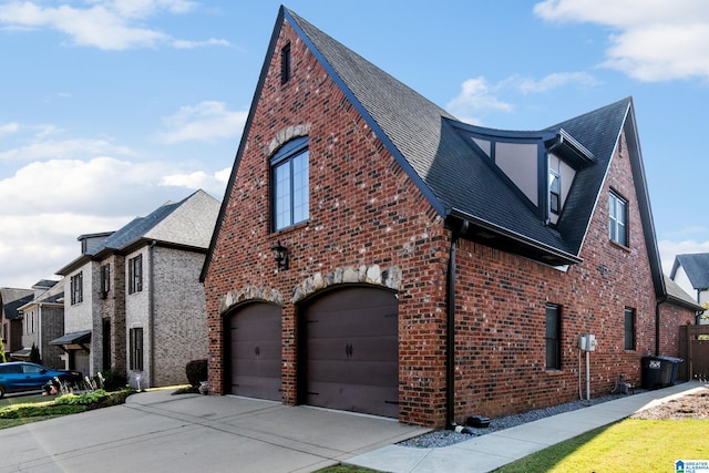 view of side of property featuring a garage