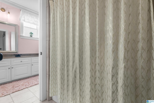 bathroom with vanity, curtained shower, and tile patterned floors