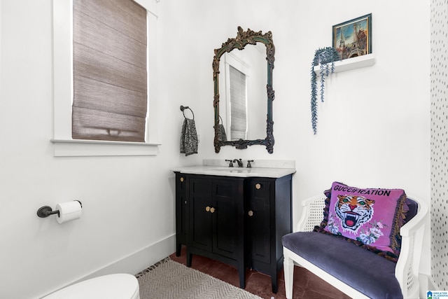 bathroom featuring vanity and toilet