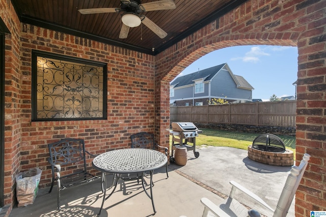 view of patio with a grill and ceiling fan