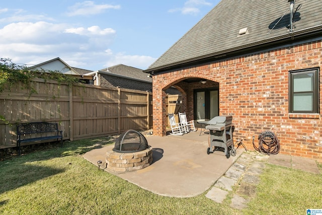 view of patio / terrace with area for grilling and a fire pit