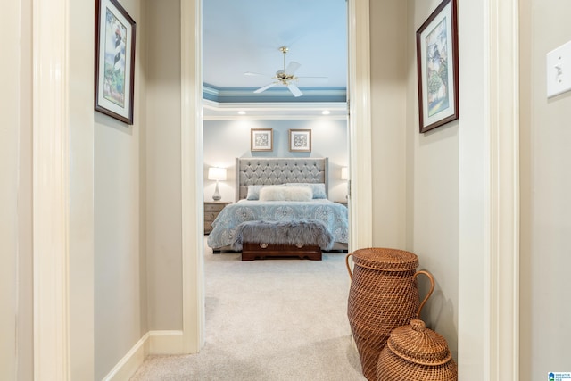 bedroom featuring crown molding, carpet flooring, and ceiling fan