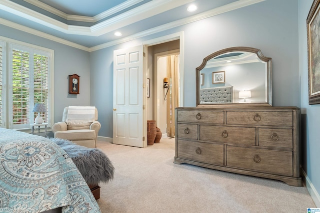 bedroom with crown molding and light colored carpet