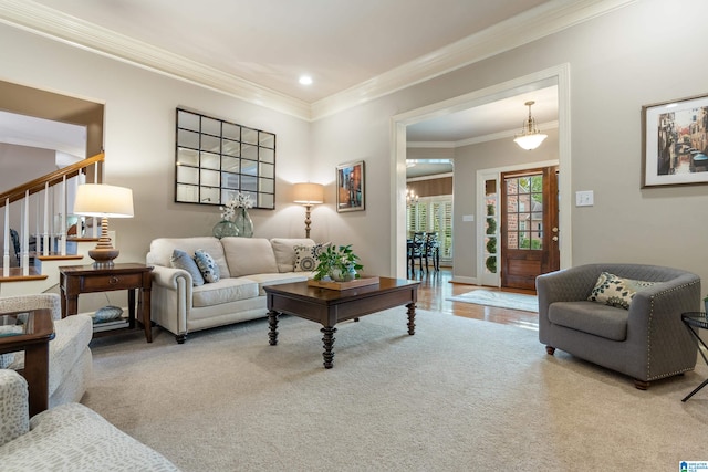 carpeted living room featuring crown molding