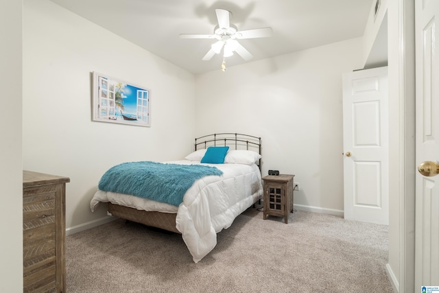 bedroom with ceiling fan and light colored carpet