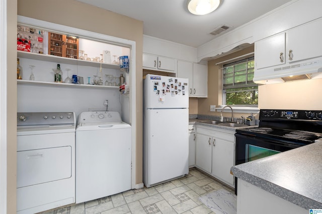 2061 Montreat Cir Unit C, Vestavia Hills, AL 35216 - kitchen with freestanding refrigerator, separate washer and dryer, a sink, under cabinet range hood, and black electric range oven