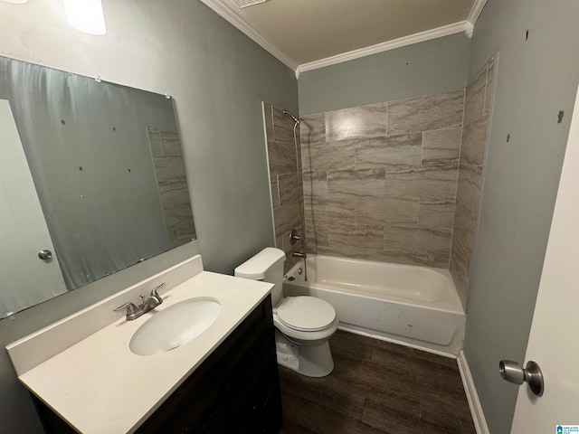 full bathroom featuring toilet, wood-type flooring, ornamental molding, tiled shower / bath combo, and vanity