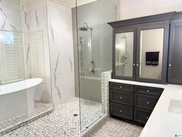 bathroom with a soaking tub, walk in shower, and vanity