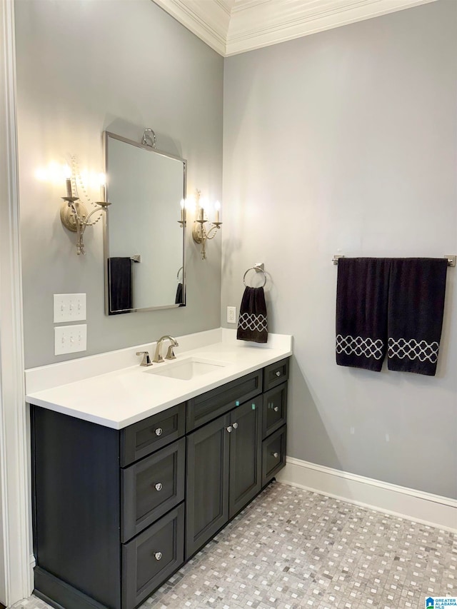 bathroom with baseboards, ornamental molding, and vanity