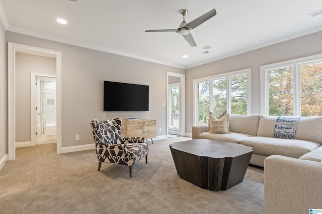 living area featuring light carpet, ornamental molding, and baseboards