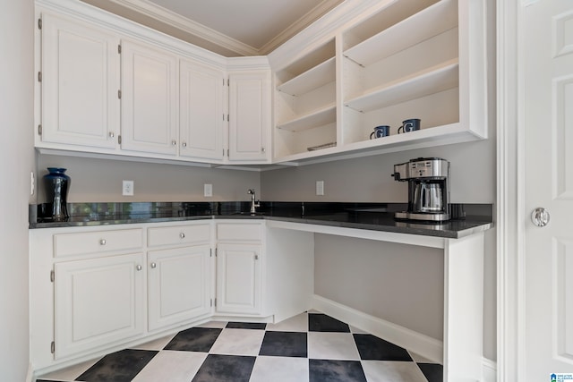 kitchen with dark countertops, white cabinetry, and tile patterned floors