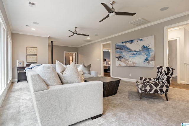 living room featuring ornamental molding and visible vents